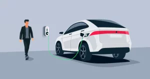 A person demonstrating how to charge an electric vehicle.